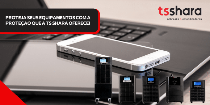 da TS Shara com o texto 'PROTEJA SEUS EQUIPAMENTOS COM A PROTEÇÃO QUE A TS SHARA OFERECE!'. A imagem de fundo é um notebook com um smartphone, e cinco modelos de nobreaks pretos estão dispostos em miniatura à frente dos dispositivos eletrônicos.
