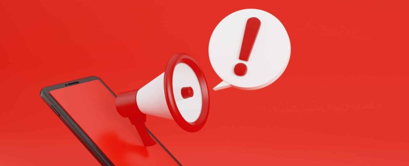 uma imagem de um desenho de um celular e na tela saindo um ícone de megafone