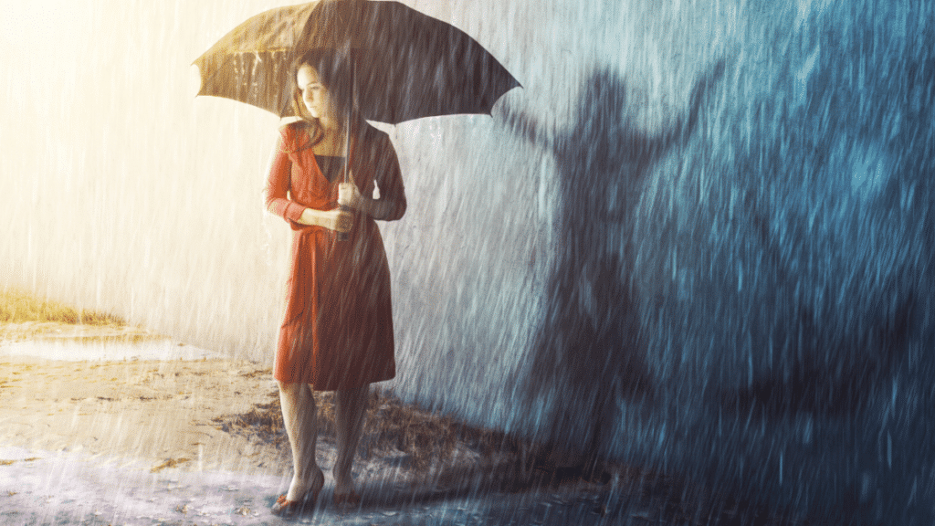 uma imagem ilustrativa de uma mulher segurando um guarda chuva em meio a periodo de chuvas de verão