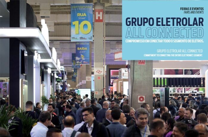 Foto de uma feira ou evento com grande público, destacando o banner "Grupo Eletrolar All Connected".
