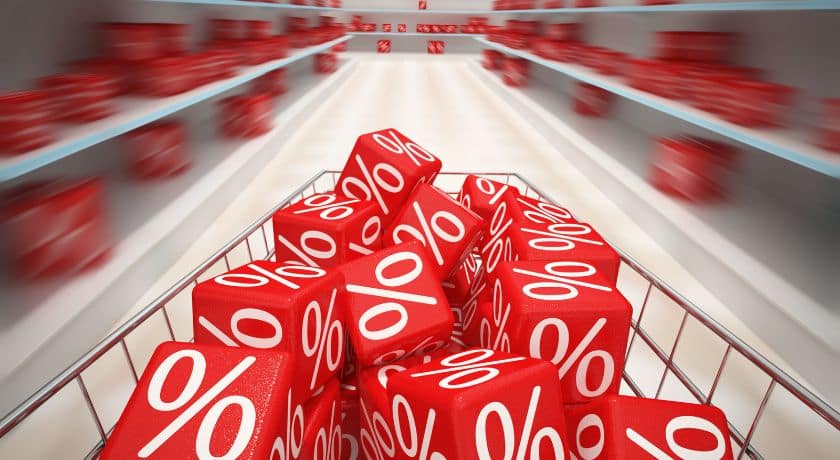 carrinho de compras com simbolo de desconto