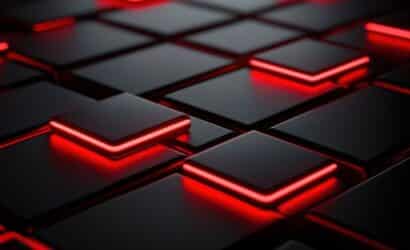 Uma grade abstrata de cubos ou quadrados pretos e cinza escuro, com alguns deles em relevo e contornados por uma linha de luz neon vermelha brilhante.