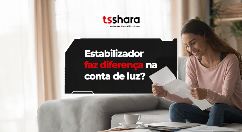 Pessoa analisando conta de luz ao questionar uso de estabilizador.